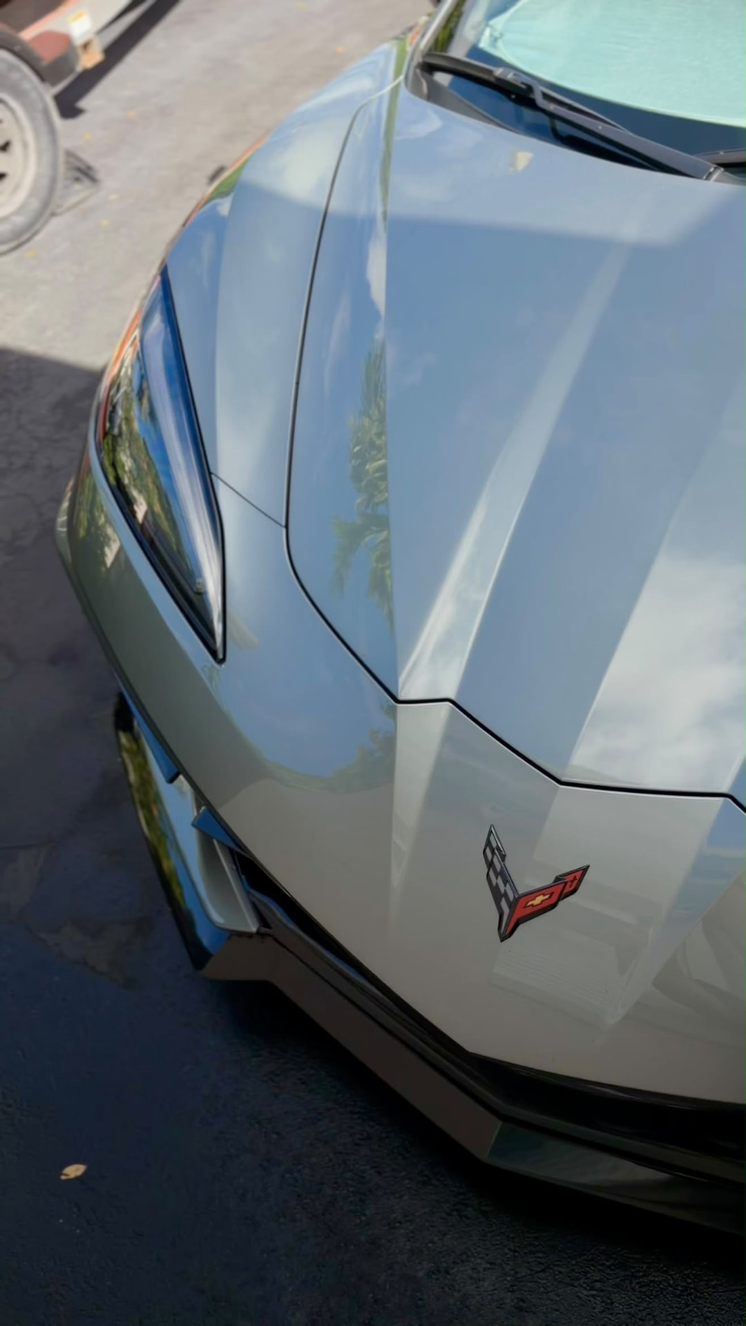 Silver Corvette C8 front hood and headlight with deep gloss
